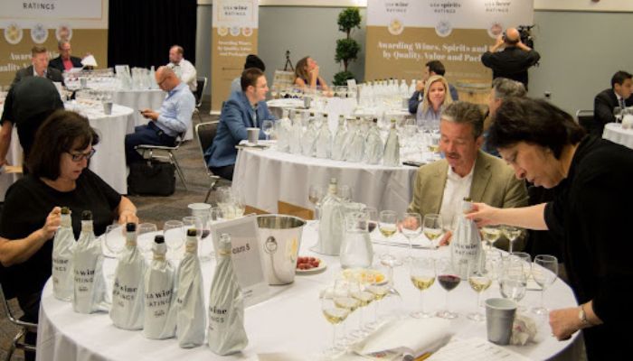 Professional wine tasters judging the wines.