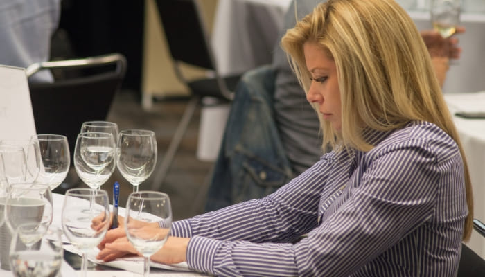 Wine-Judge examining and tasting wines at 2018 USA Wine Ratings Competition in San Francisco